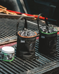 Thumbnail for 16 oz CYNCH jar with two CYNCH bags on a tailgate