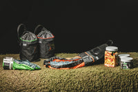 Thumbnail for CYNCH jars and bags lined up on turf