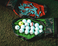 Thumbnail for Green CYNCH sorting mat holding golf balls and tees